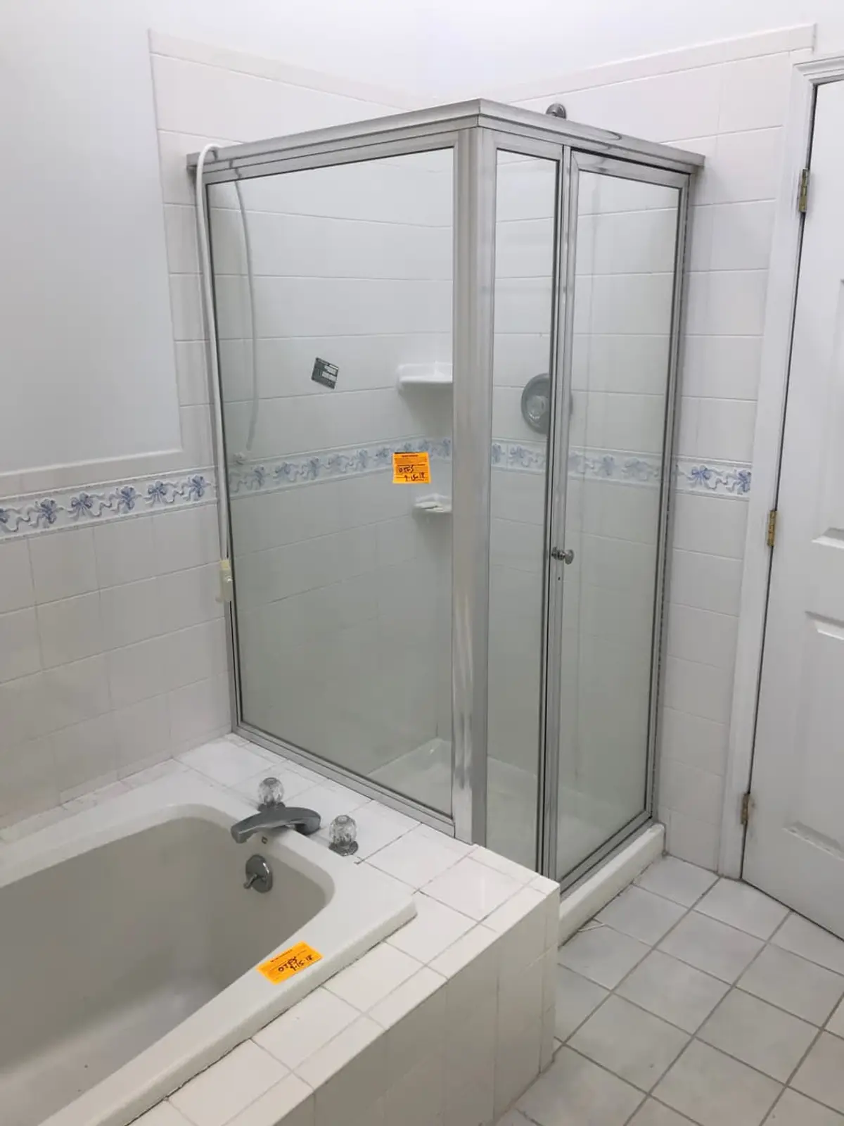 Downsizing or retiring in Commack: dated bathroom with a corner shower and soaking tub